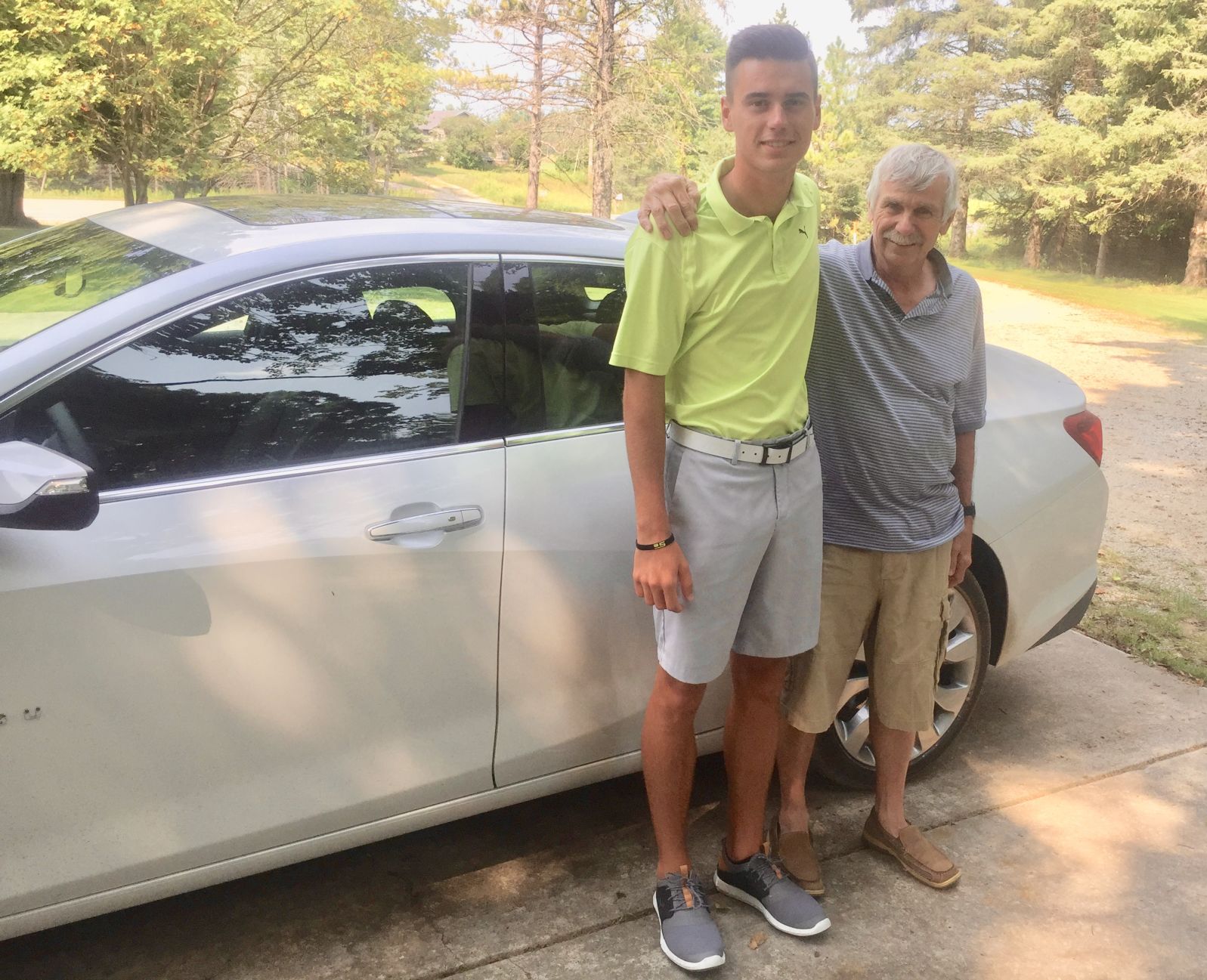 Hunter Eichhorn with grandfather Steve Pipkorn and 2018 Chevy Malibu he won